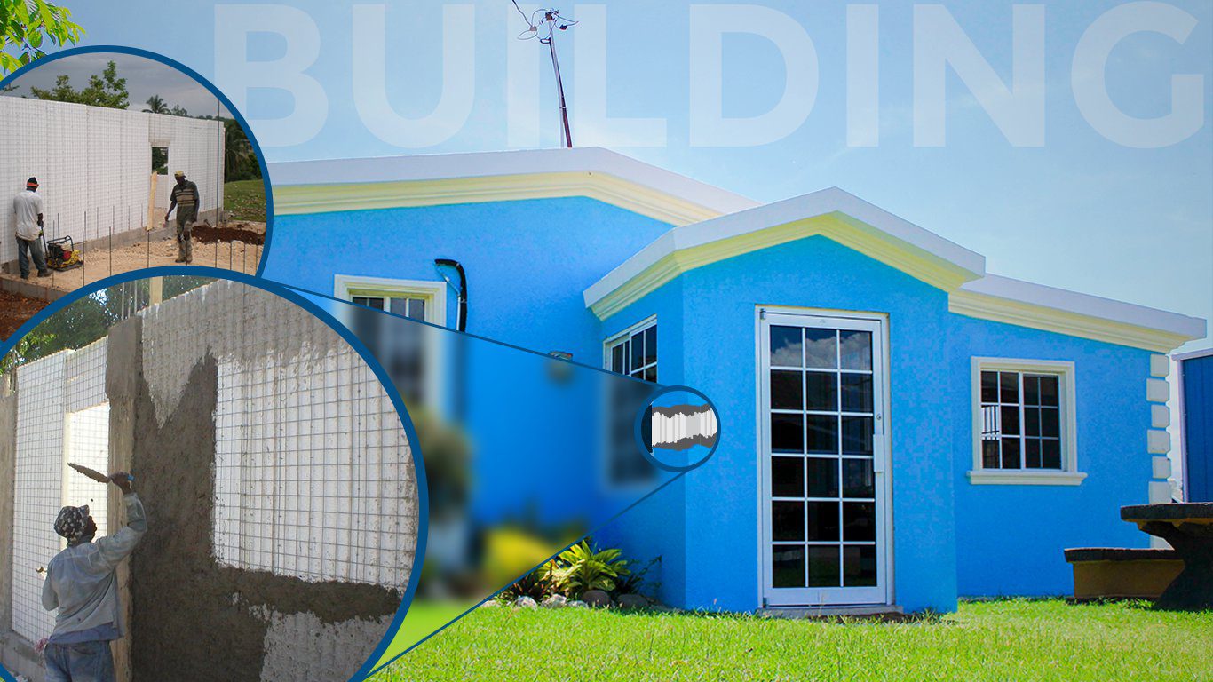 A blue building with a window and some grass