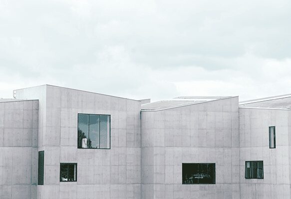 A building with two windows and one window is open.