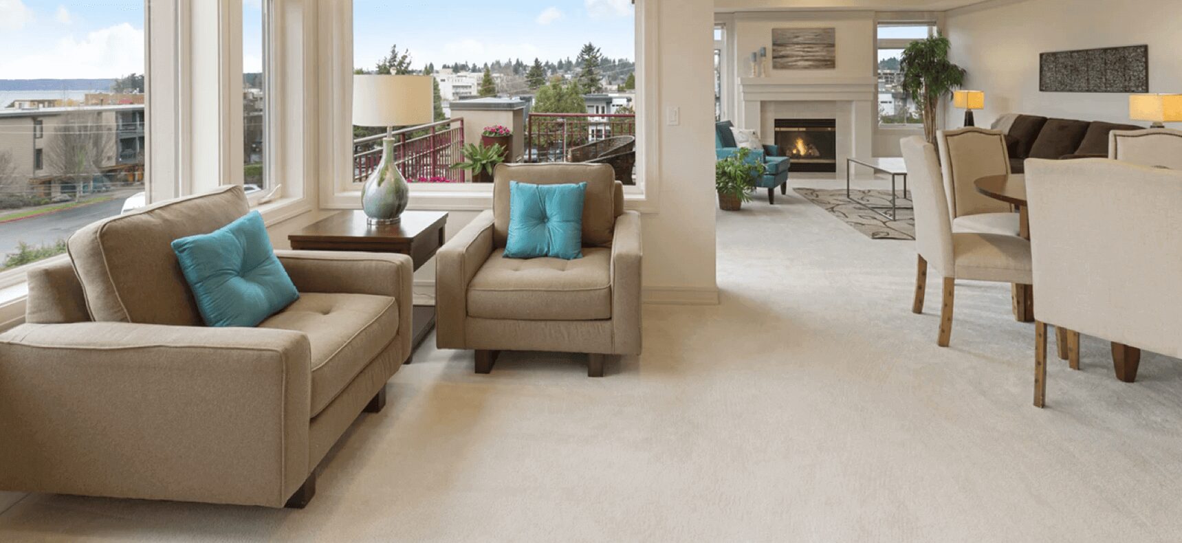 A living room with two couches and a fireplace in a balcony