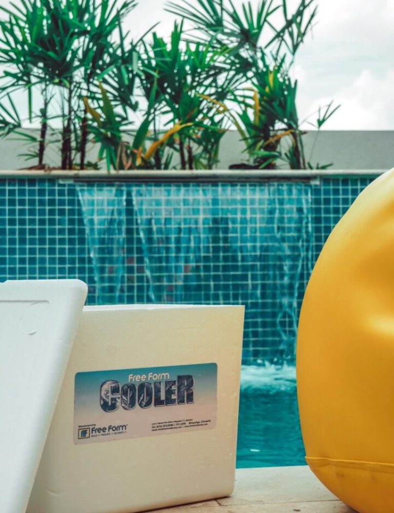 A pool with a yellow hat and a cooler